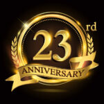 23rd golden anniversary logo, with shiny ring and ribbon, laurel wreath isolated on black background, vector design